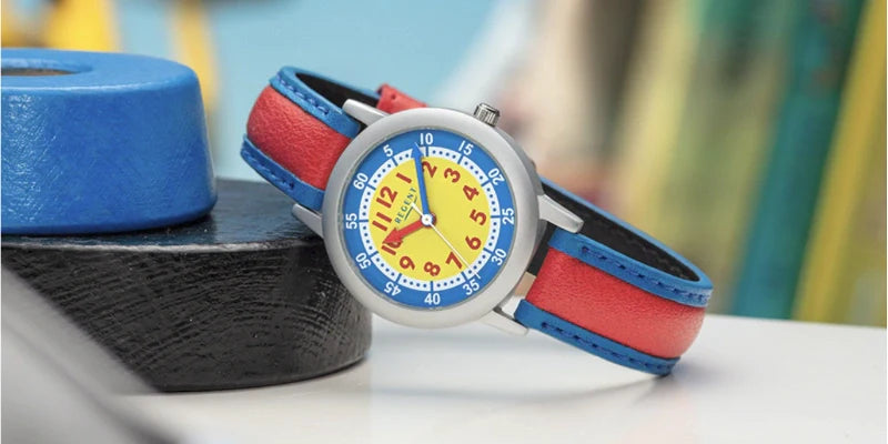 kinderuhr rot blaues uhrband blau gelbes zifferblatt