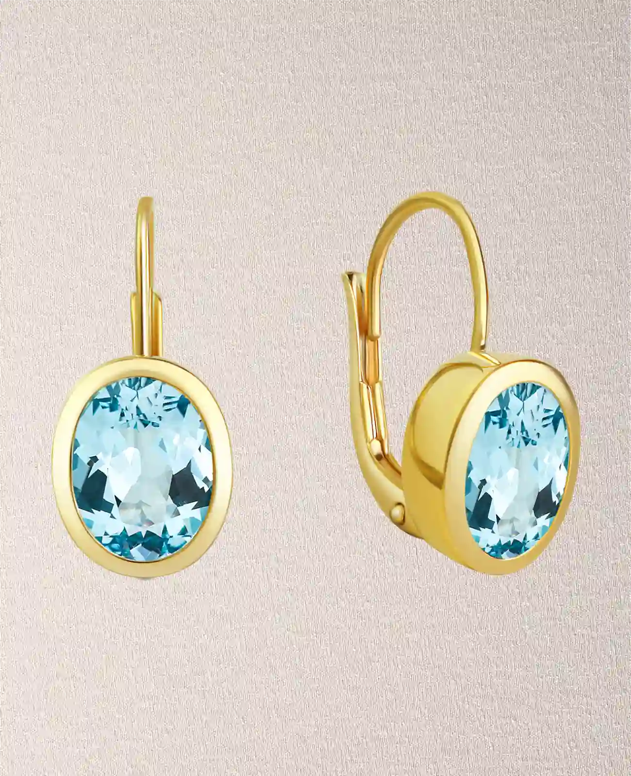 kurze button ohrhänger mit ovalen blautopas