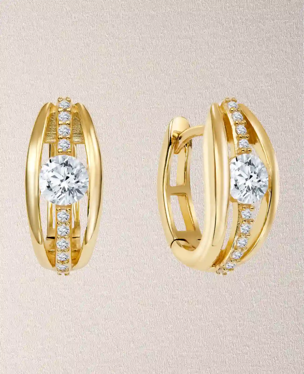 ovale creolen in der mitte großer zirkonia stein darunter und darüber je 4 kleine zirkonia steine