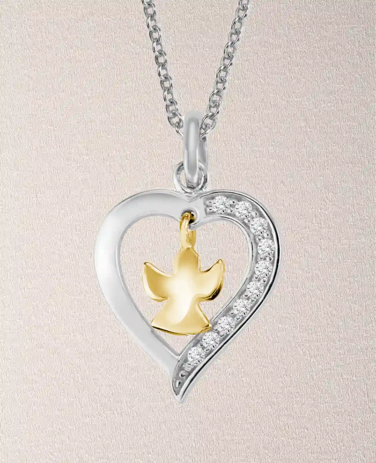 Ankerkette mit Herz Anhänger darin baumelnder Schutzengel